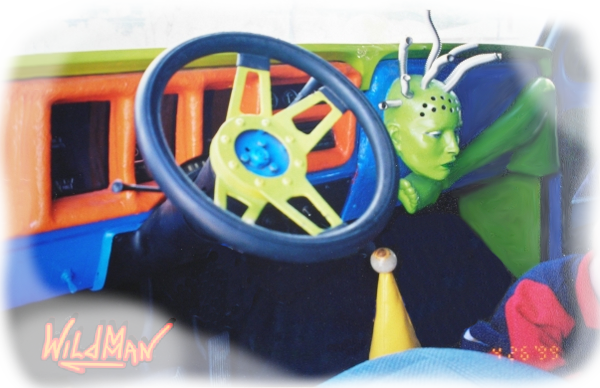 This is an image of the dashboard and interior of the Dragon monster truck. The gauge cluster was made of fiberglass. A fiberglass alien head with stainless steel flex tubes is centered on the dash so the air conditioner blew air through it.