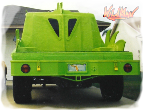 This is a rear view image of Wildmman's Dragon monster truck. The body was textured like reptile skin.